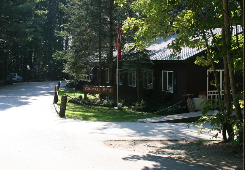 Playground and activity area at Colonial Mast Campground